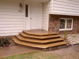 front door brick stair system in Fargo by oasis landscapes
