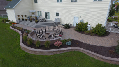 Beautiful Brick Patio with Fire Feature by Oasis Landscapes in Fargo, ND