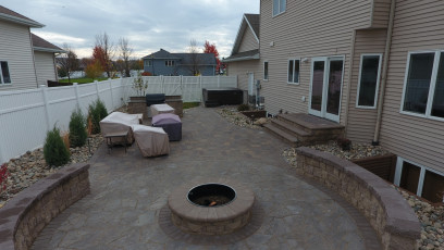 Patio with Fire Pit in Small Space by Oasis Landscapes