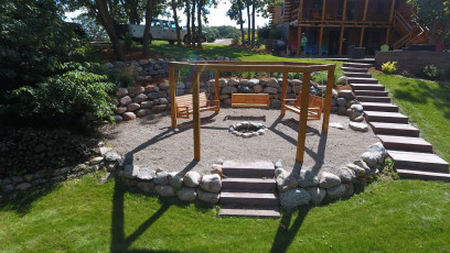 Octagon Fire Pit with Landscaping by Oasis Landscapes
