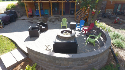 Fire Pit with Sitting Wall by Oasis Landscapes