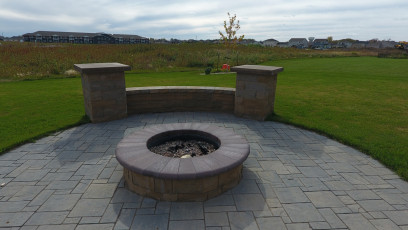 Circular Patio with Central Fire Feature by Oasis Landscapes