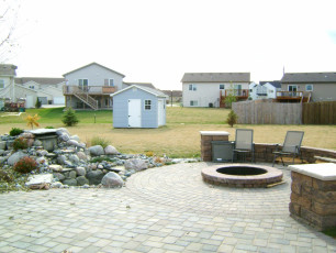 Paver Patio with Fire Feature and Water Feature in Fargo by Oasis Landscapes