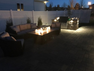 Night Shot of Fire Table installed by Oasis Landscapes in Fargo ND