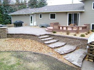 paver patio with seating area and stair system by oasis landscapes