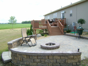 deck that comes down to patio with fire pit at Fargo, ND home