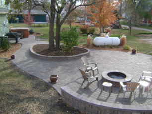 hardscape patio with retaining wall island by oasis landscapes