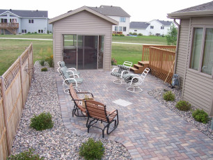 fenced in landscaping at Fargo, ND home by Oasis Landscapes