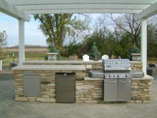 Outdoor Kitchen with Mini Fridge in Fargo, ND by Oasis Landscapes
