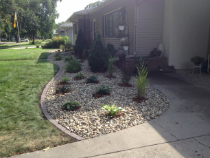 Front yard landscaping with rock fill in west fargo