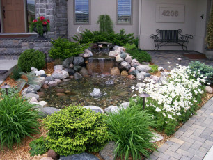 Small Pond with Waterfall in Fargo by Oasis Landscapes