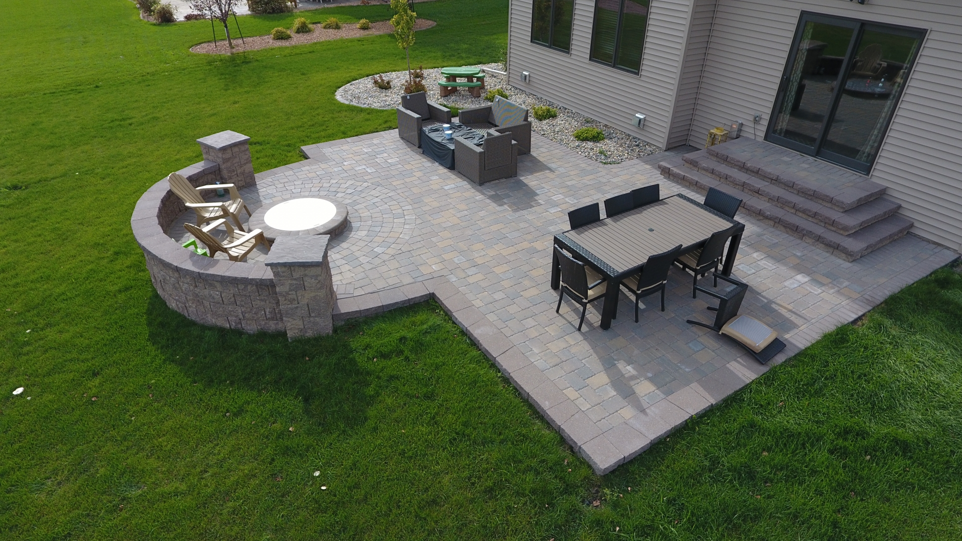 Backyard Fire Pit With Seat Wall And Paver Patio Oasis Landscapes