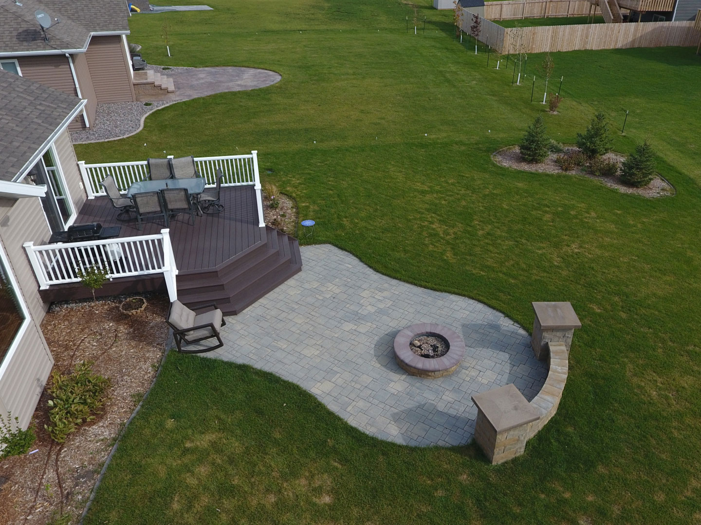 Backyard Fire Pit with Seat Wall and Paver Patio - Oasis ...