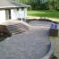 Paver patio with staircase and grilling station