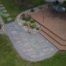 Deck with paver walkway, lanscape edgin, and rock fill