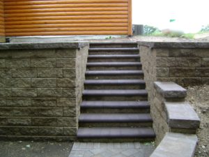 Staircase with retaining wall by Oasis Landscapes